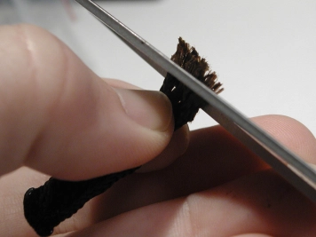 Trim the frayed part Trim the frayed part